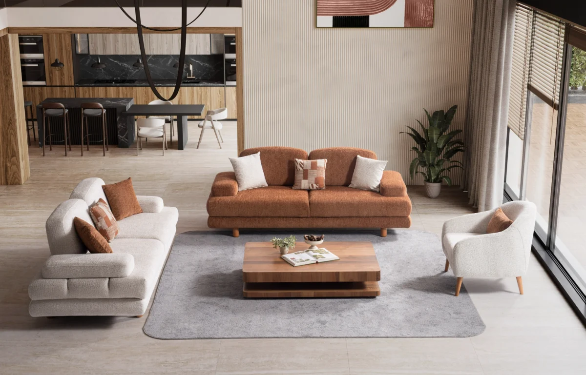 A harmonized Troyas sofa set showcasing a visual dialogue between warm terracotta and ivory tones, featuring matching organic curved silhouettes in a luxury contemporary setting – SofaTurkey.