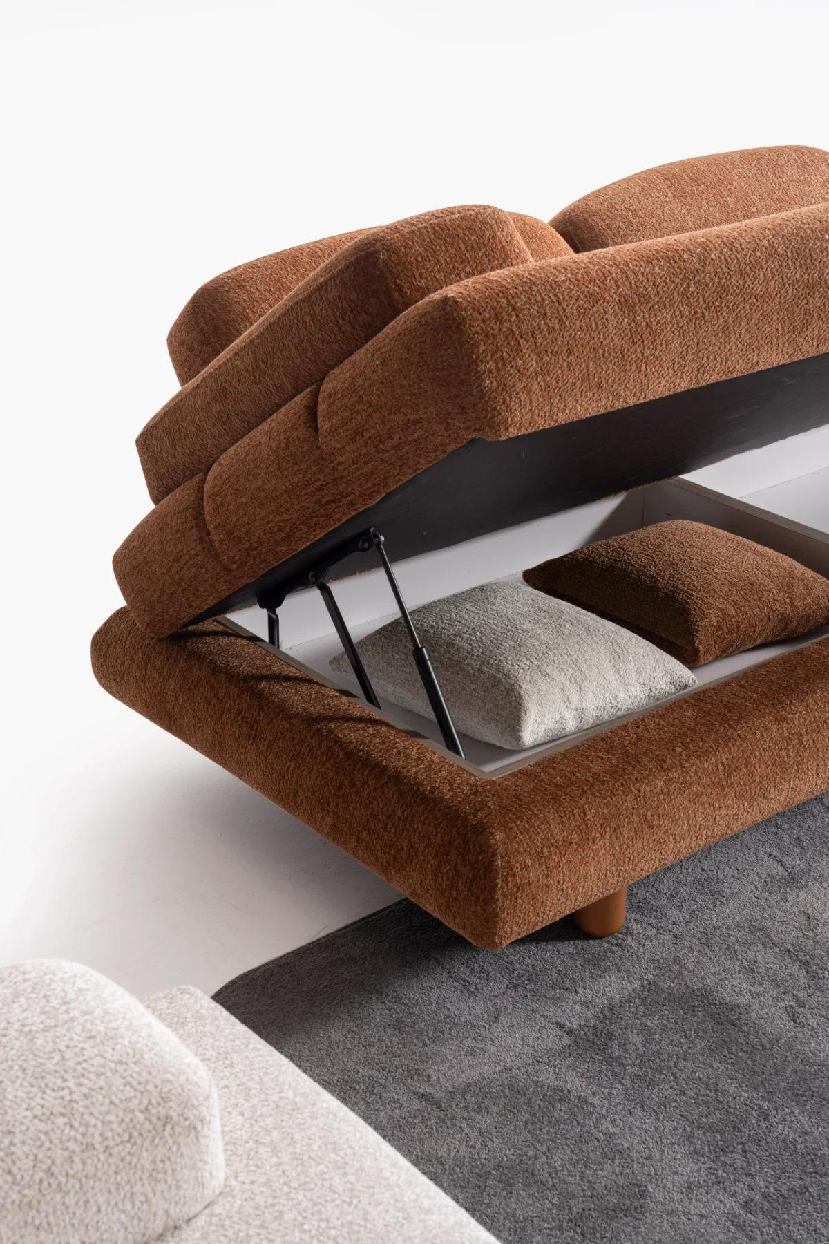 Modern living room featuring the Troyas sofa set in a warm terracotta hue, showcasing soft curves and a textured finish for a cozy, contemporary aesthetic – SofaTurkey.