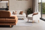 A harmonized Troyas sofa set showcasing a visual dialogue between warm terracotta and ivory tones, featuring matching organic curved silhouettes in a luxury contemporary setting – SofaTurkey.