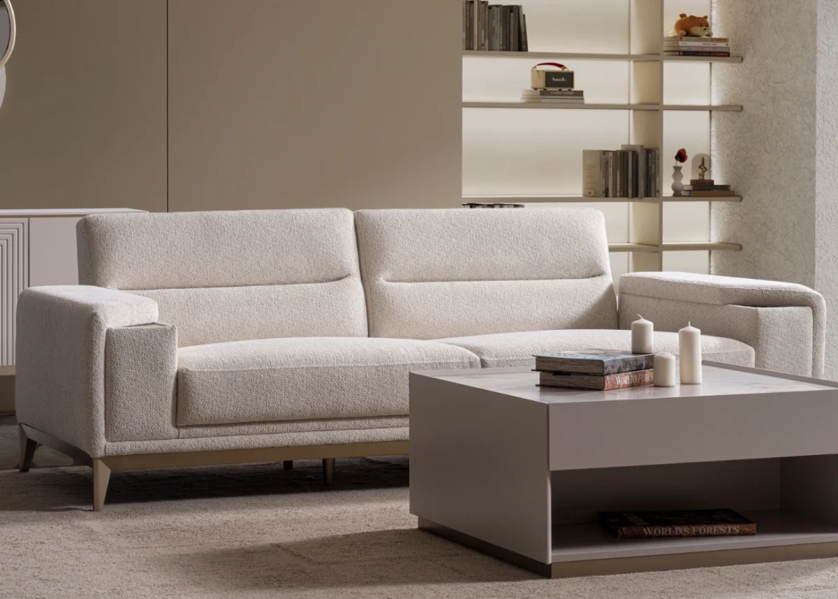 Velora Sofa modern cream living room couch featuring plush channel-tufted back cushions and integrated adjustment mechanism.