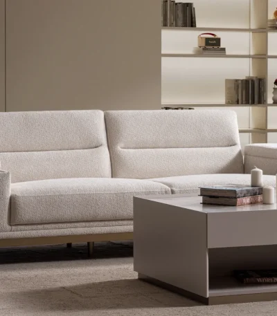 Velora Sofa modern cream living room couch featuring plush channel-tufted back cushions and integrated adjustment mechanism.