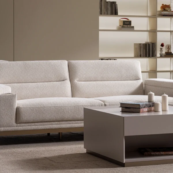 Velora Sofa modern cream living room couch featuring plush channel-tufted back cushions and integrated adjustment mechanism.
