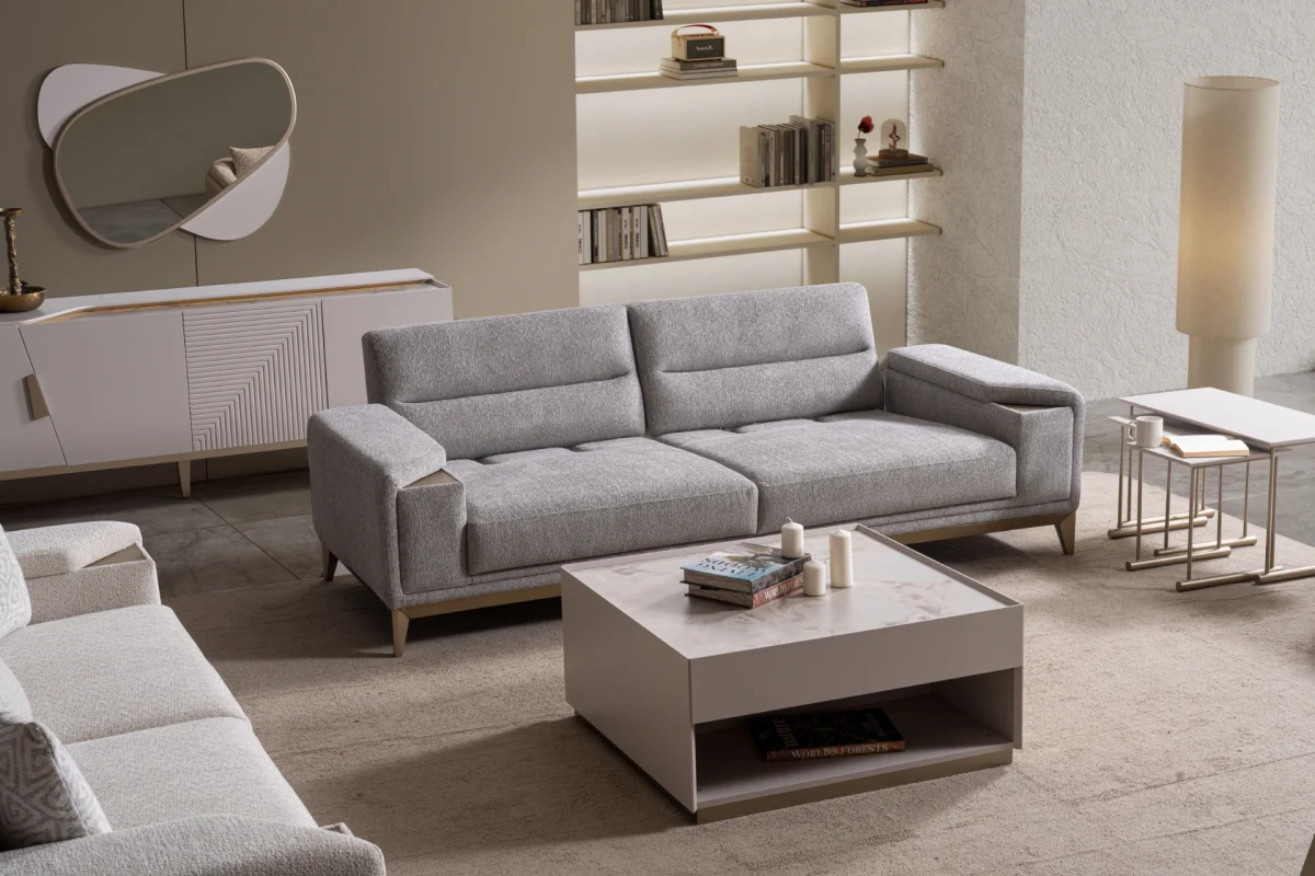 Velora Sofa modern cream living room couch featuring plush channel-tufted back cushions and integrated adjustment mechanism.