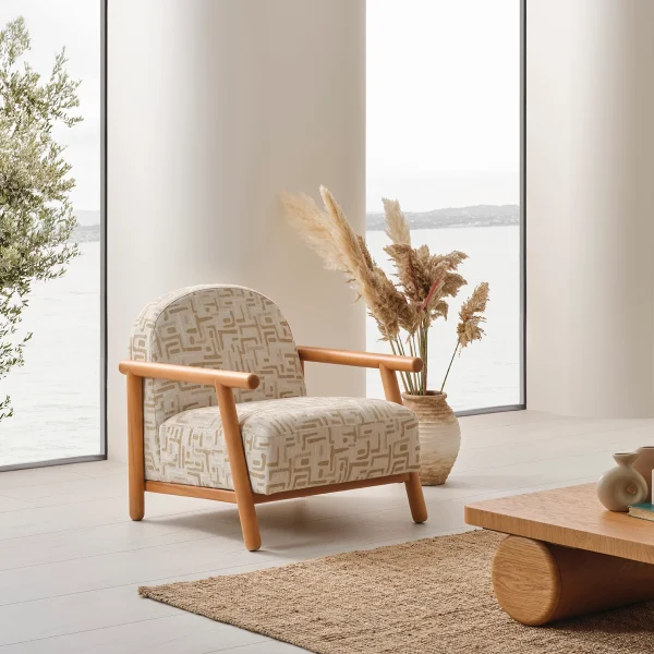 A tranquil Venera Armchair situated in a brightly lit, peaceful living space, designed to evoke a sense of calm, balance, and refined home living.