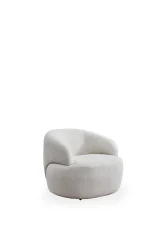 The Vogue Armchair is a masterpiece of organic design. Its soft fabric offers cocoon-like comfort, elevating any modern interior.