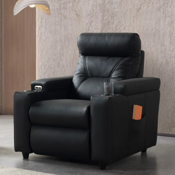 A modern single-seater power recliner armchair featuring a high pillow backrest, integrated cup holders in the wide armrests, side storage pocket, and sleek black upholstery.
