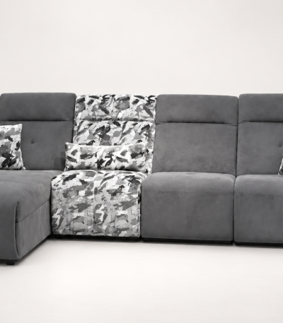 A modern sectional power recliner sofa featuring an integrated chaise lounge, patterned accent backrest and seat section, soft throw cushions, and smooth high-back plush cushioning set against a clean backdrop.