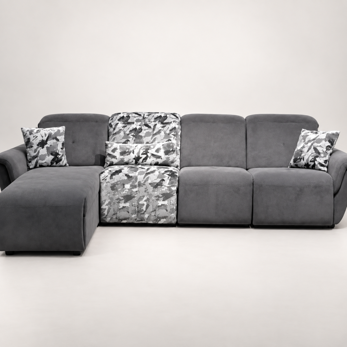 A modern sectional power recliner sofa featuring an integrated chaise lounge, patterned accent backrest and seat section, soft throw cushions, and smooth high-back plush cushioning set against a clean backdrop.