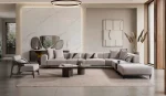 A modern modular Nova Corner Sofa featuring generous deep seating, multiple plush backrest cushions, geometric accent pillows, an ottoman extension, and low-profile metal legs against a plain white background.