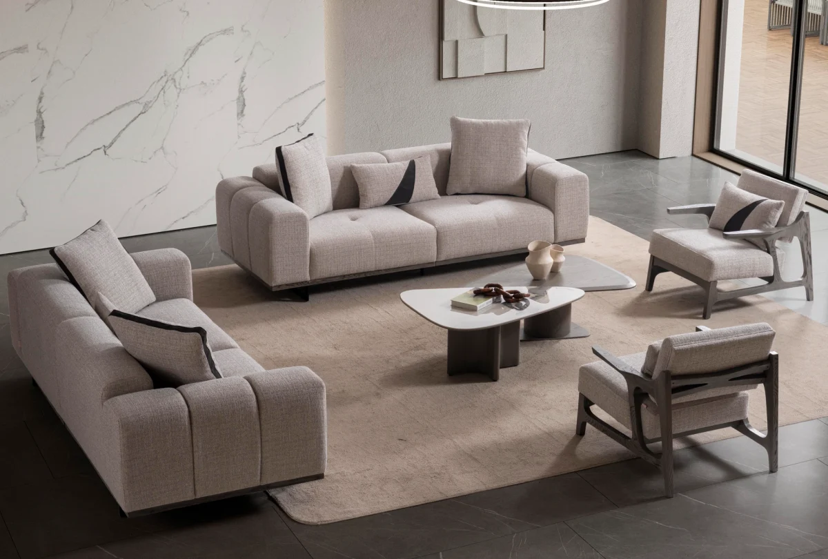 A modern Nova Sofa Set including two deep-seated plush sofas and two architectural wooden-frame accent armchairs arranged in a contemporary open-plan interior.