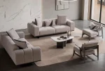 A modern Nova Sofa Set including two deep-seated plush sofas and two architectural wooden-frame accent armchairs arranged in a contemporary open-plan interior.