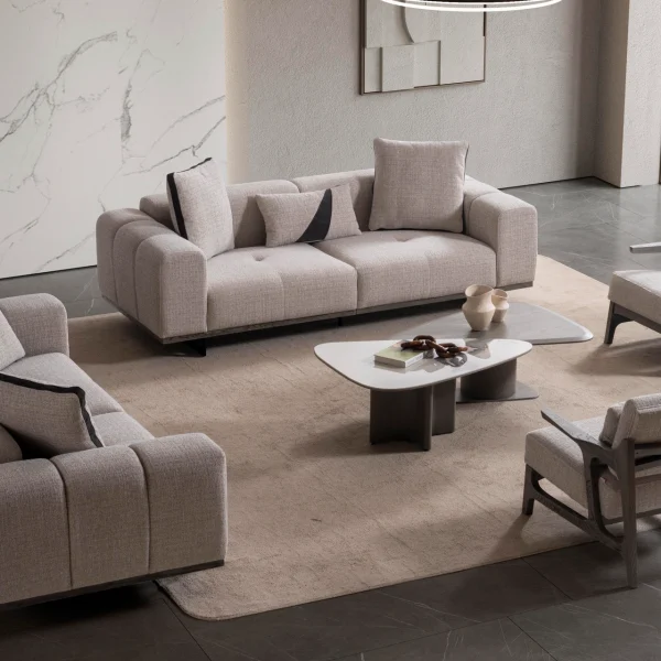 A modern Nova Sofa Set including two deep-seated plush sofas and two architectural wooden-frame accent armchairs arranged in a contemporary open-plan interior.